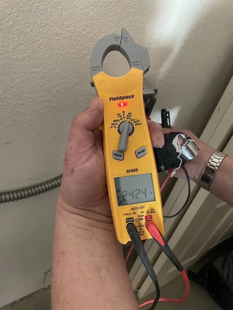 Voltage testing with clamp meter during Outlet Installation in Stafford